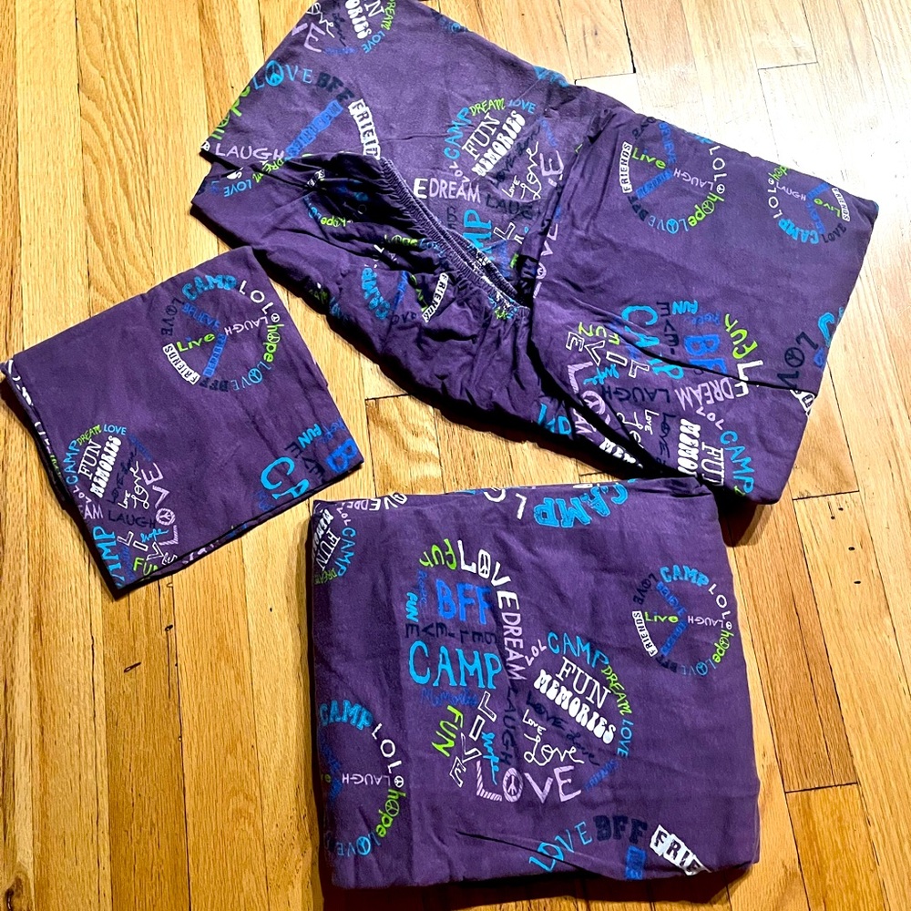 Purple ‘camp love’ cot sheet set